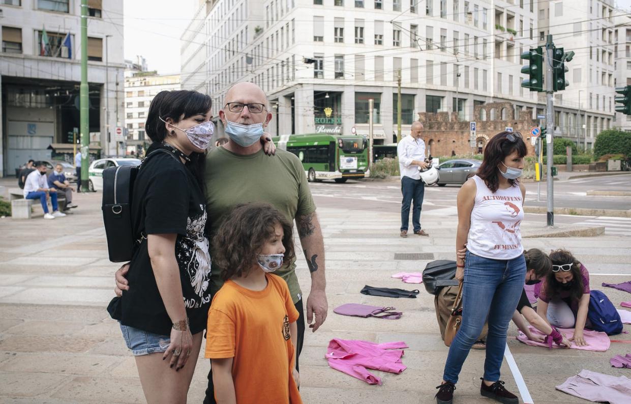 <span class="caption">A family poses after the Not One Less protest in Missori Square in Milan on June 26. Family and friends are important allies against domestic violence.</span> <span class="attribution"><a class="link " href="https://www.gettyimages.com/detail/news-photo/family-poses-for-photos-in-the-square-during-the-news-photo/1223404332?adppopup=true" rel="nofollow noopener" target="_blank" data-ylk="slk:Valeria Ferraro/SOPA Images/LightRocket via Getty Images;elm:context_link;itc:0;sec:content-canvas">Valeria Ferraro/SOPA Images/LightRocket via Getty Images</a></span>