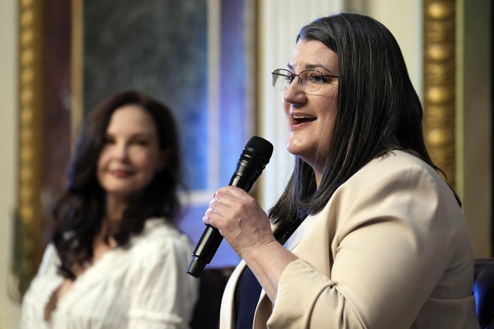 Ashley Judd, left, listens to Shelby Rowe, right, Executive Director of the Suicide Prevention Research Center, during an event on the White House complex in Washington, Tuesday, April 23, 2024, with notable suicide prevention advocates. The White House held the event on the day they released the 2024 National Strategy for Suicide Prevention to highlight efforts to tackle the mental health crisis and beat the overdose crisis. (AP Photo/Susan Walsh)