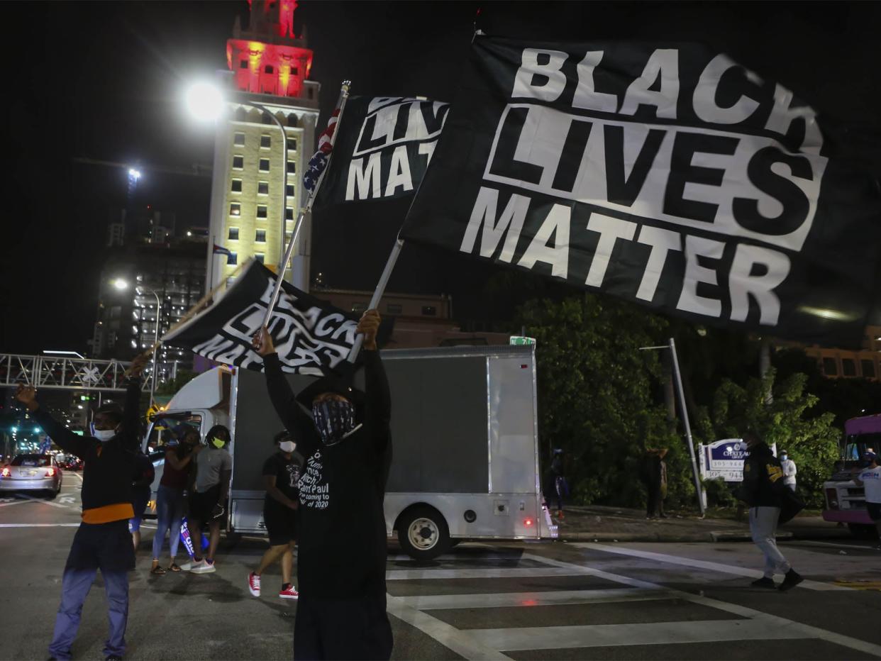 <p>Black Lives Matter protestors celebrating Joe Biden’s win as 46th US President in Miami, Florida, 7 November</p> (Getty Images)