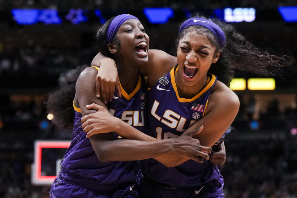 LSU guard Flau'jae Johnson, left, celebrates with forward Angel Reese after defeating Virginia Tech in the Final Four of the NCAA women's tournament at American Airlines Center in Dallas on March 31, 2023. (Kirby Lee/USA TODAY Sports)