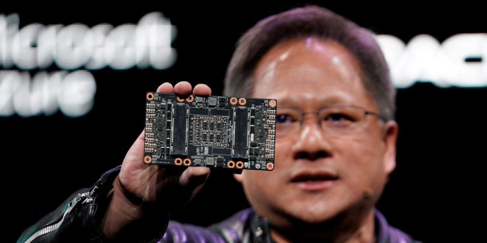 FILE PHOTO: Jensen Huang, CEO of Nvidia, shows the NVIDIA Volta GPU computing platform at his keynote address at CES in Las Vegas, Nevada, U.S. January 7, 2018. REUTERS/Rick Wilking/File Photo