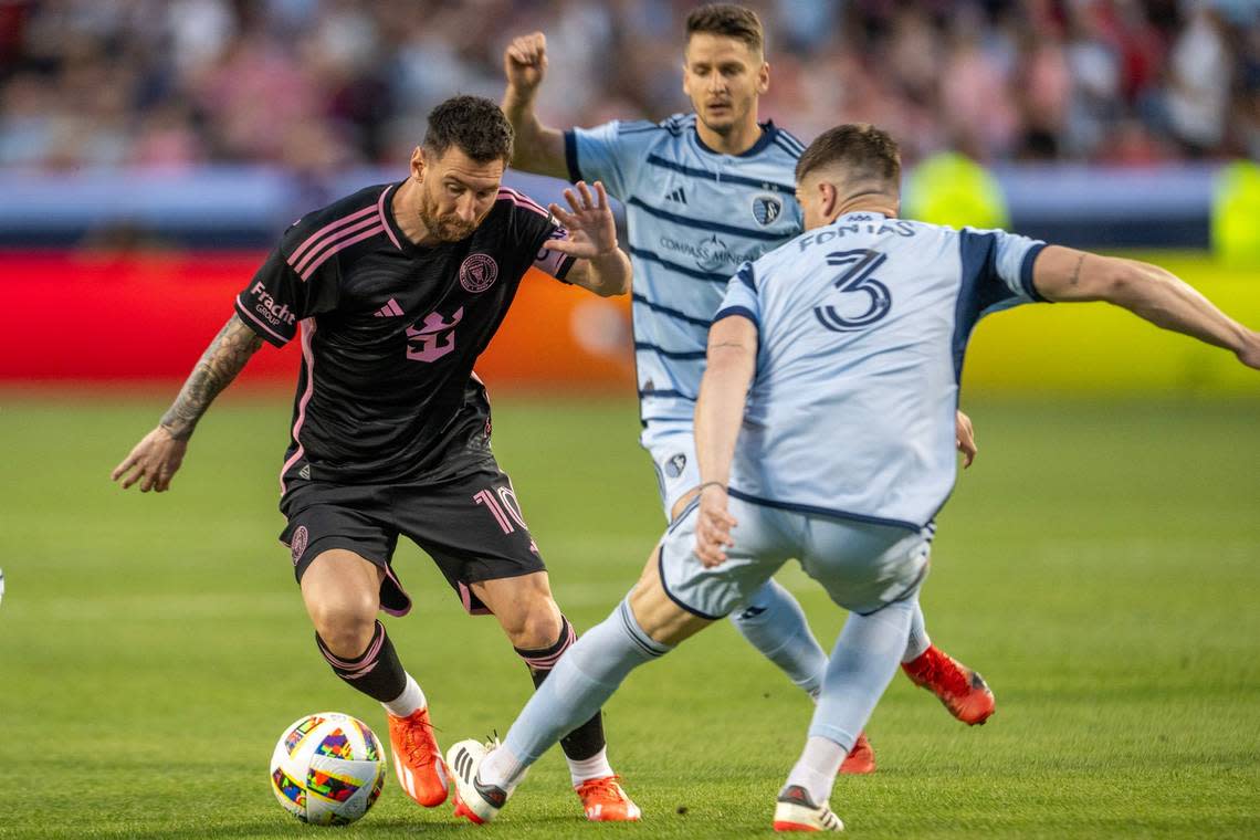 Inter Miami forward Lionel Messi (10) bypass Sporting Kansas City defender Andreu Fontàs (3) in the first half during an MLS game at GEHA Field at Arrowhead Stadium on Saturday, April 13, 2024, in Kansas City. Emily Curiel/ecuriel@kcstar.com