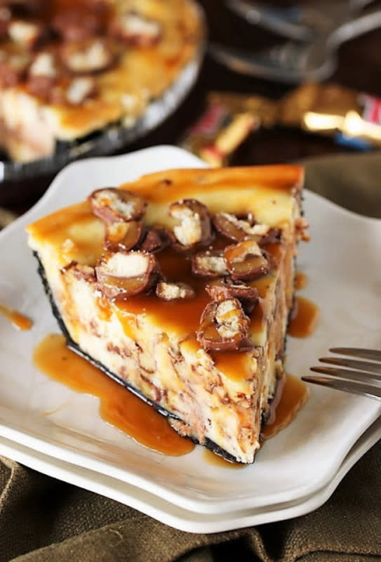 <p>The Kitchen's My Playground</p><p>Love Twix candy bars? Then you'll love them even more when they're surrounded by creamy cheesecake in this scrumptious pie.</p><p><strong>Get the recipe: </strong><strong><a href="https://www.thekitchenismyplayground.com/2014/03/twix-cheesecake-pie-brandon-lafells.html" rel="nofollow noopener" target="_blank" data-ylk="slk:Twix Cheesecake Pie;elm:context_link;itc:0;sec:content-canvas" class="link ">Twix Cheesecake Pie </a></strong></p>