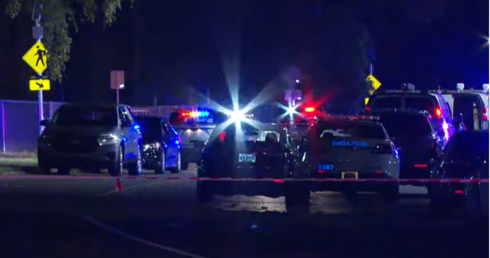 A large presence of Jacksonville police work the scene of an officer-involved shooting of a juvenile who they said fired into a crowd of people leaving the First Coast vs. Ribault High School football game that ended in the third quarter because of fighting.