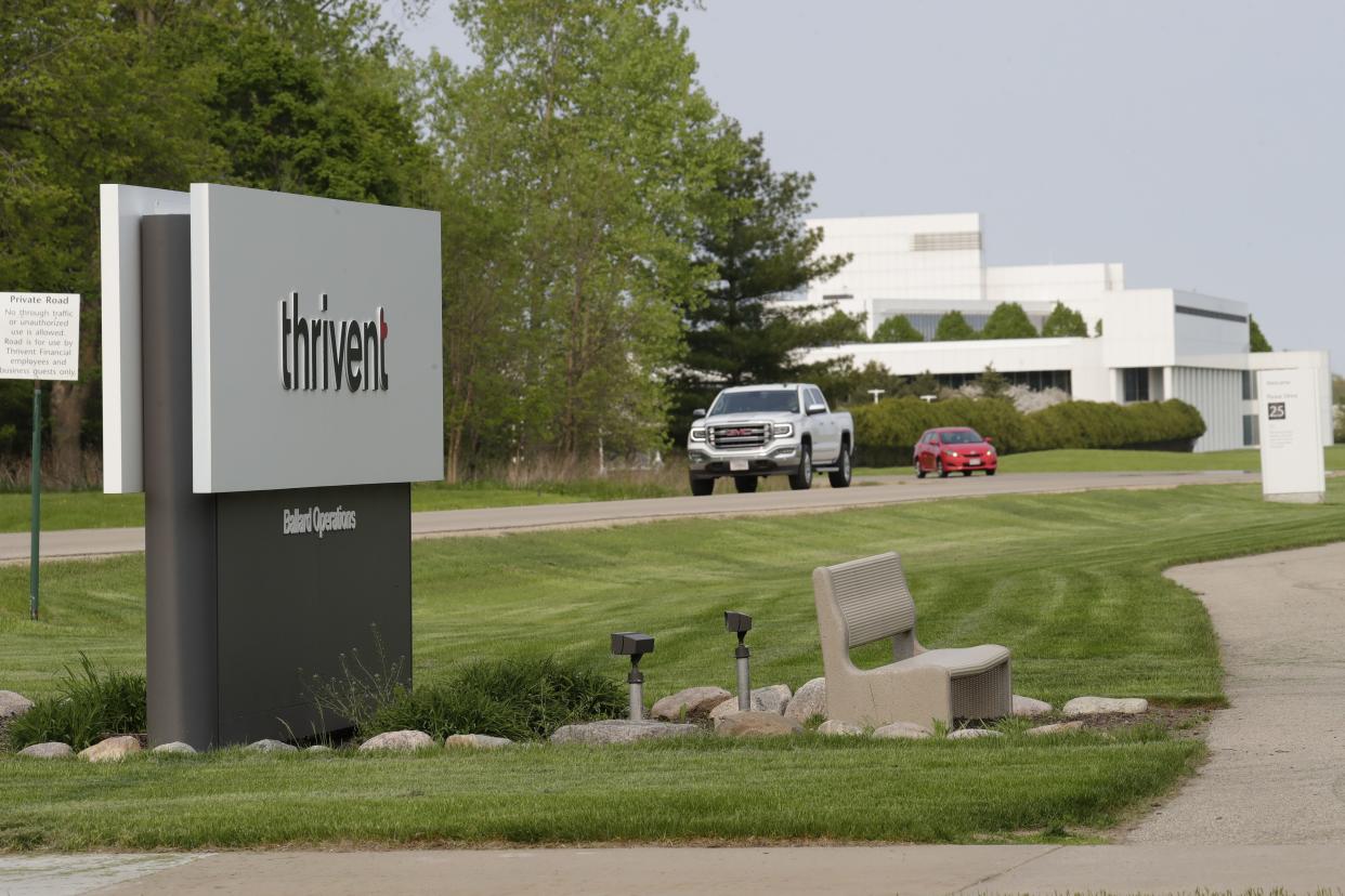 Vehicles leave Thrivent's Ballard Operations Center, 4321 N. Ballard Road, in Appleton.