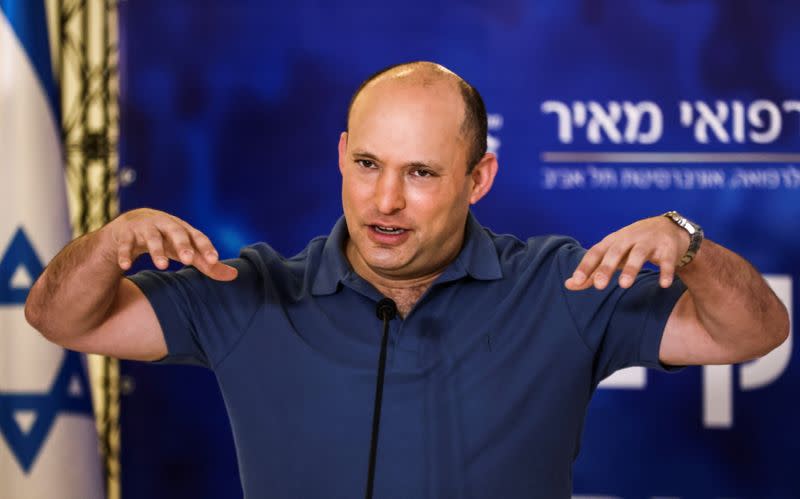 FILE PHOTO: Israeli Prime Minister Naftali Bennett speaks to the media before receiving third shot of coronavirus disease (COVID-19) vaccine in Kfar Saba