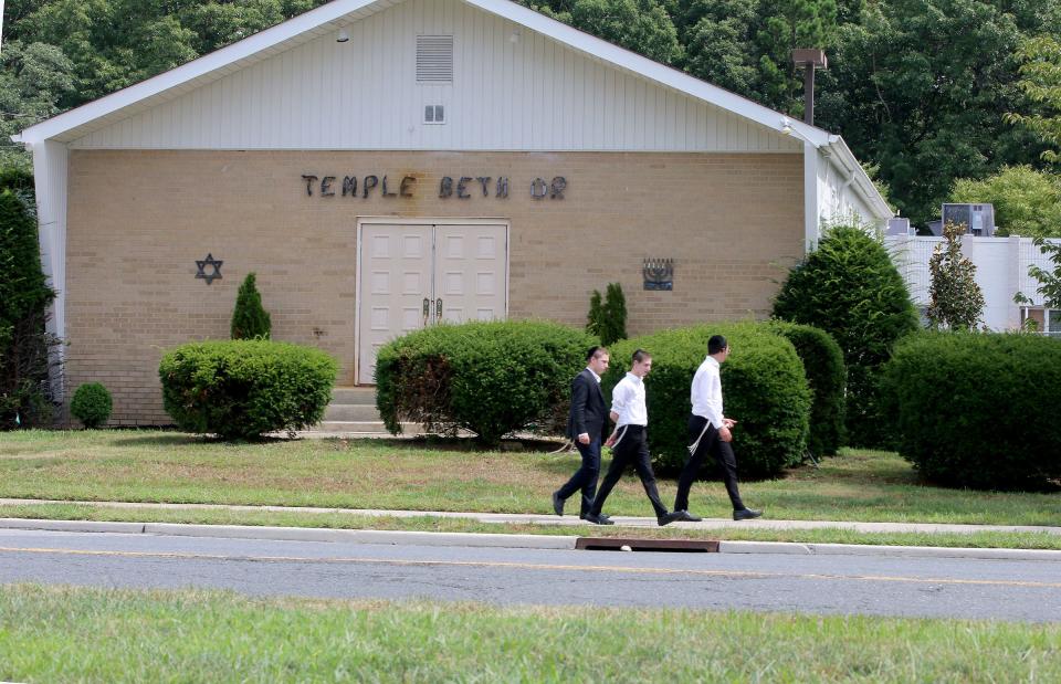 Boys walk in front of the former Temple Beth Or on Van Zile Road in Brick Township Tuesday, August 17, 2021.  The new owners of the site began operating it as an Orthodox Jewish boy's high school before they obtained required township approvals, according to Brick officials.