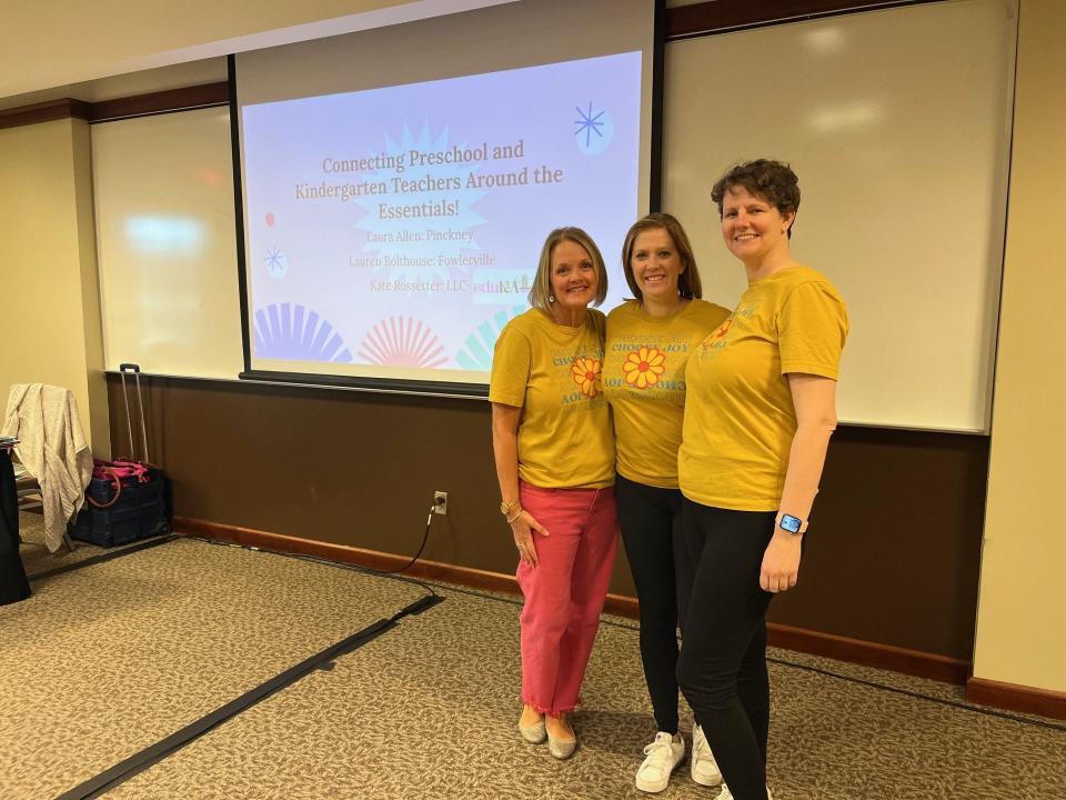 Literacy coaches Kate Rossetter (left), Lauren Simmons (center) and Laura Allen (right) pose for a photo.
