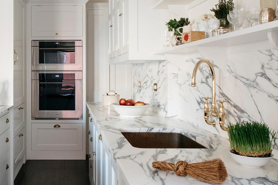 <p>Your work surfaces take up considerable space in the kitchen, so don’t waste an opportunity to introduce brightening and light-reflecting finishes. A white marble is a brilliant choice, especially when used in large blocks. </p><p>Pictured: <a href="https://www.plainenglishdesign.co.uk/" rel="nofollow noopener" target="_blank" data-ylk="slk:Bespoke kitchen by Plain English;elm:context_link;itc:0;sec:content-canvas" class="link ">Bespoke kitchen by Plain English</a></p>