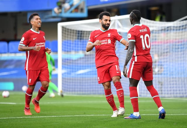 Mohamed Salah, centre, and Sadio Mane, right, celebrate