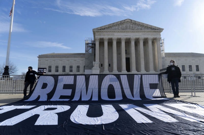 People demonstrate outside the U.S. Supreme Court in Washington Thursday as oral arguments were heard on whether former President Donald Trump can remain on Colorado's Republican Primary ballot for the 2024 election. Photo by Bonnie Cash/UPI