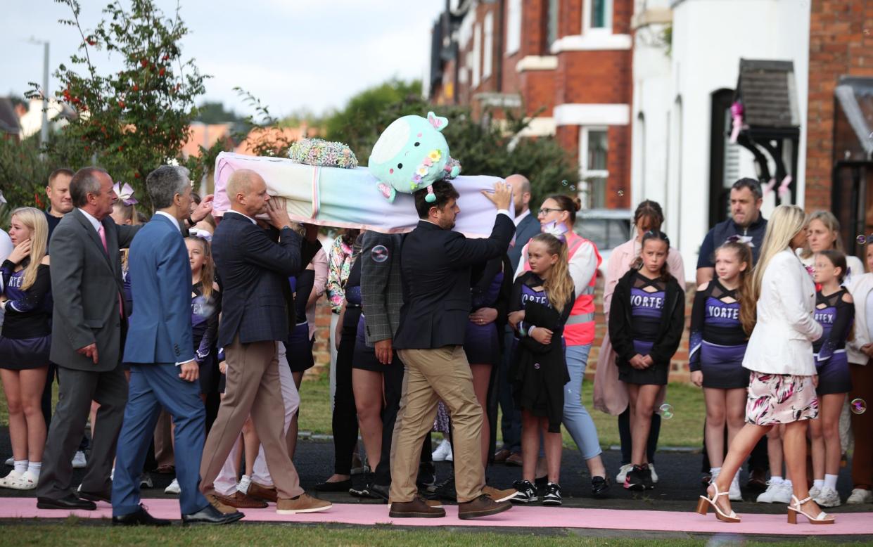 Elsie Dot Stancombe's coffin is carried into St John's Church