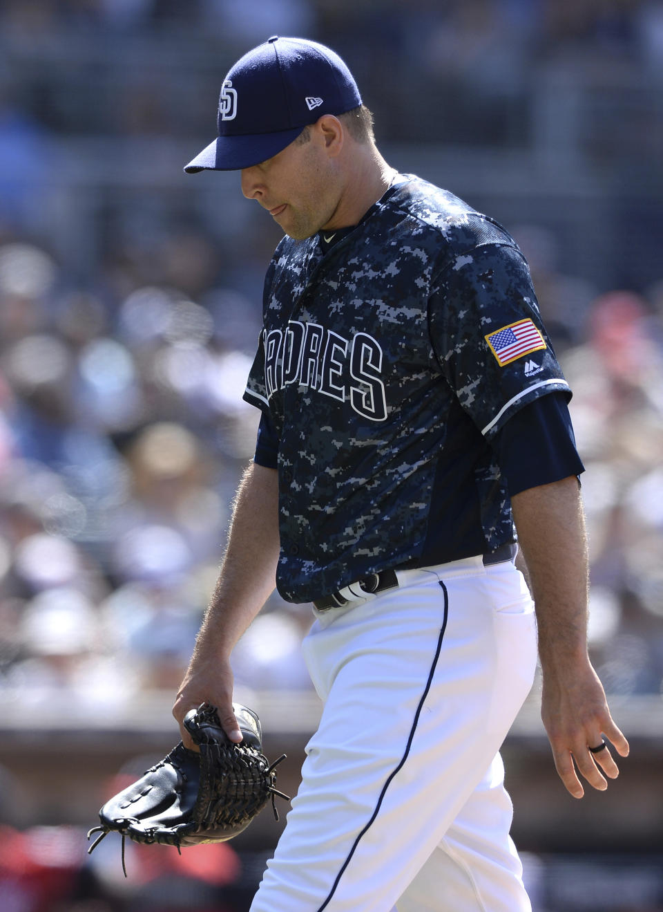 San Diego Padres relief pitcher Craig Stammen walks to the dugout after recording the last out of the top of the eighth inning of a baseball game against the Washington Nationals, Sunday, June 9, 2019, in San Diego. (AP Photo/Orlando Ramirez)