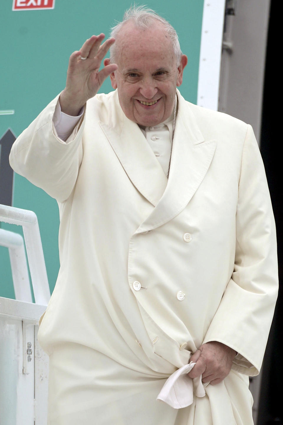 Pope Francis' waves as he disembarks from an airplane at Knock's airport, Ireland, where he will visit the Knock Shrine and recite an angelus prayer, Sunday, Aug. 26, 2018. Pope Francis is on a two-day visit to Ireland. (Yui Mok/PA via AP)