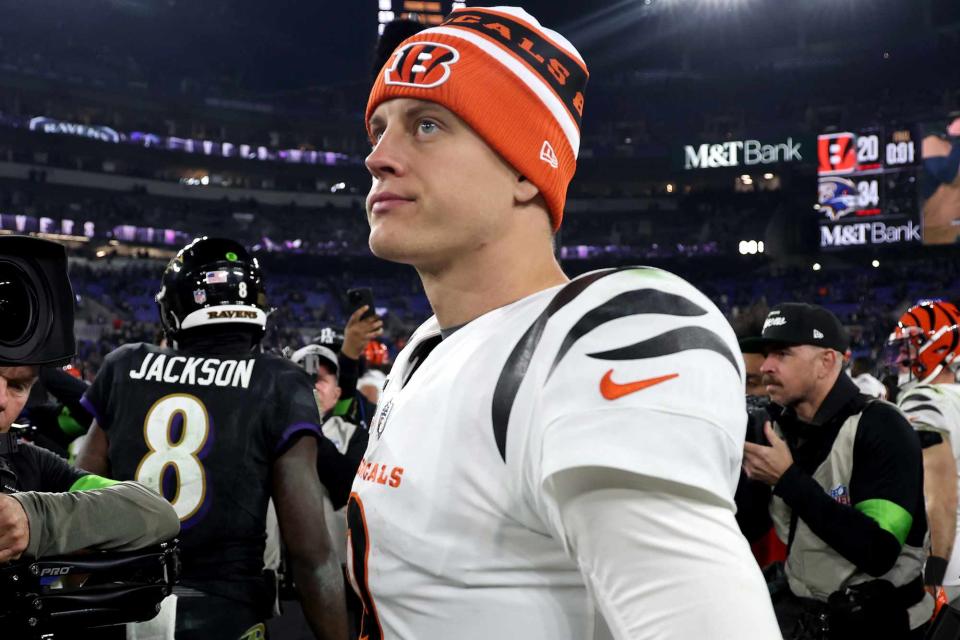 <p>Rob Carr/Getty</p> Joe Burrow walks off the field after Thursday