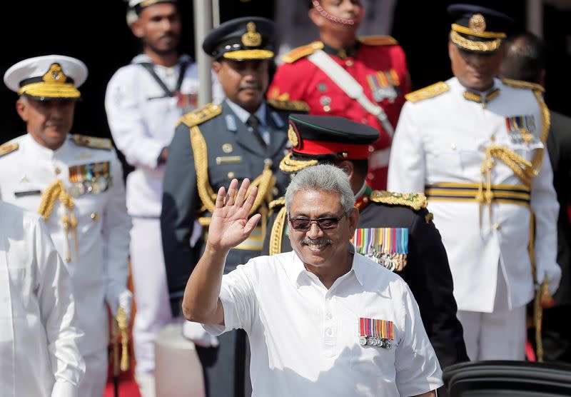 Sri Lanka's President Rajapaksa waves during the 72nd independence day ceremony, in Colombo