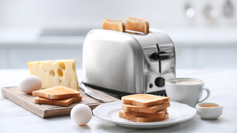 Toaster with bread and cheese