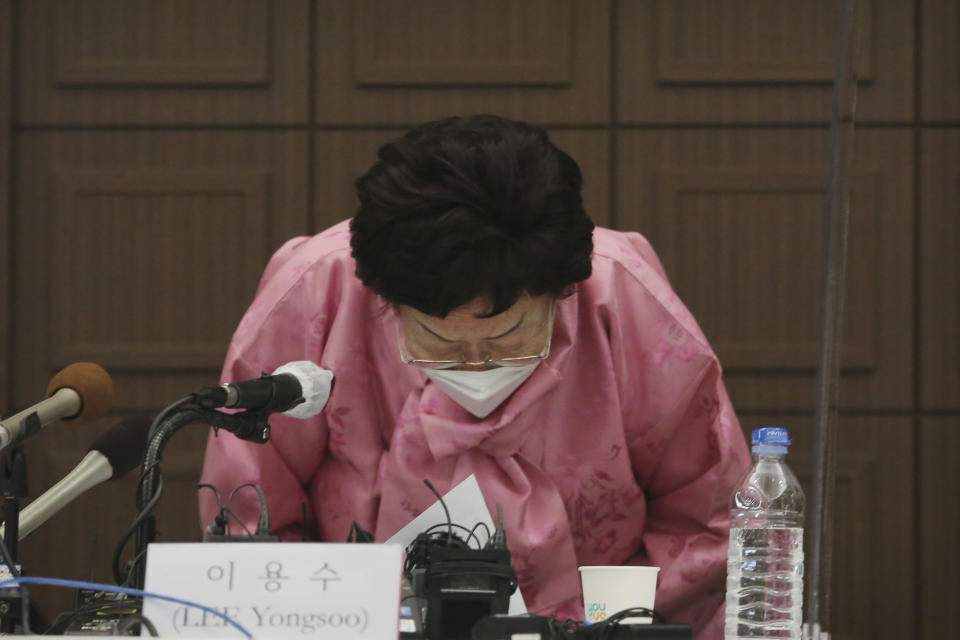 Lee Yong-soo, a South Korean woman who was sexually enslaved by Japan's World War II military, bows during a press conference at the Press Center in Seoul, South Korea, Tuesday, Feb. 16, 2021. Lee called for the leaders of both countries to settle an impasse over the issue by seeking judgment from the International Court of Justice. (AP Photo/Ahn Young-joon)