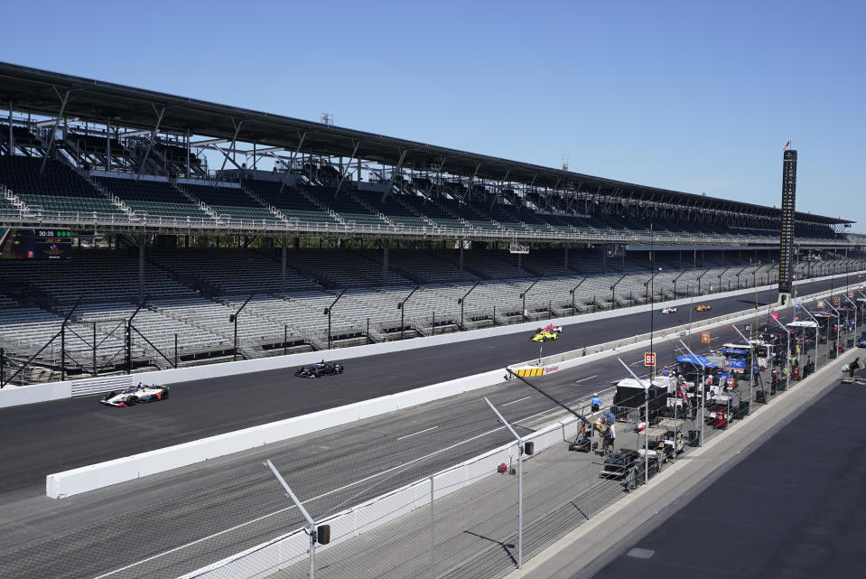 Cars drive down the main straight-a-way during the final practice session for the Indianapolis 500 auto race at Indianapolis Motor Speedway, Friday, Aug. 21, 2020, in Indianapolis. (AP Photo/Darron Cummings)