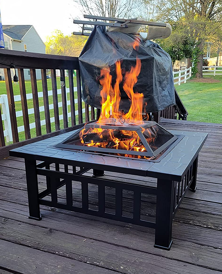 a reviewer photo of the fire pit on a back porch 