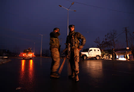 Indian soldiers stand guard near the site of explosion in Lethpora in south Kashmir's Pulwama district February 14, 2019. REUTERS/Danish Ismail