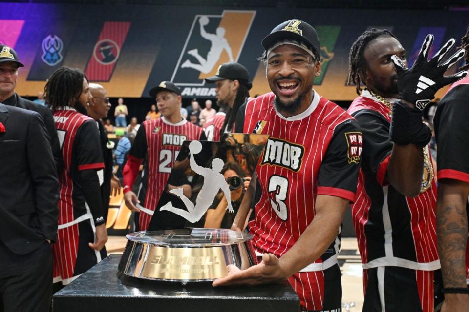 LAS VEGAS, NEVADA - AUGUST 17: Cam Hollins #3 of Mob poses with the SlamBall Championship trophy after defeating the Slashers during the SlamBall championship game at the Cox Pavilion on August 17, 2023 in Las Vegas, Nevada. (Photo by Candice Ward/Getty Images for SlamBall)