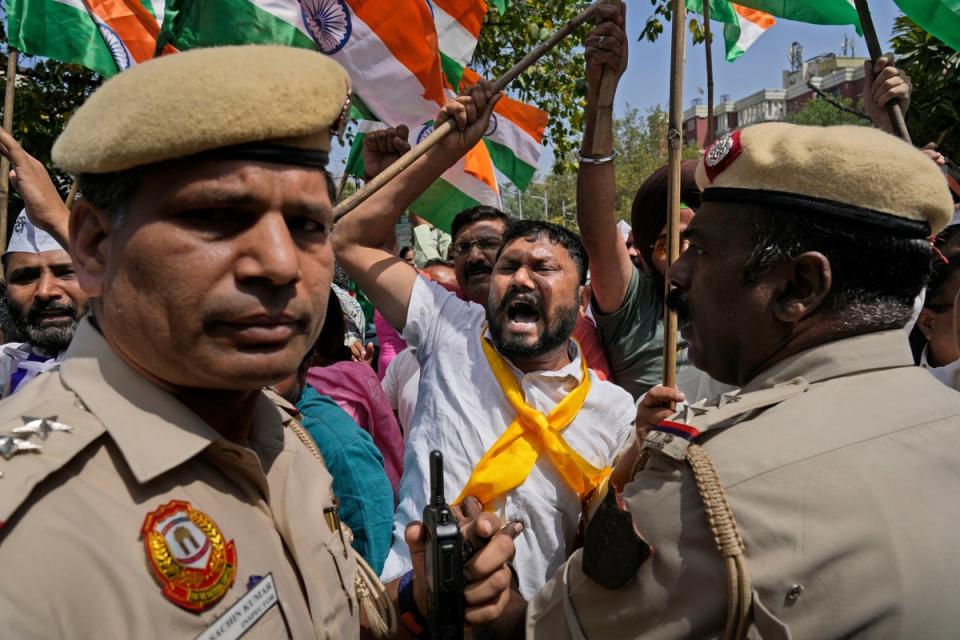 Members of Aam Admi Party, or Common Man's Party, shout slogans during a protest against the arrest of their party leader Arvind Kejriwal in New Delhi, India, Tuesday, 26 March 2024. (AP)