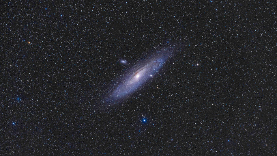 Messier 31, the Andromeda Galaxy, shot with the William Optics 51mm f/4.9 RedCat astrograph, mounted on the Sky-Watcher Star Adventurer 2i tracker as a test of the combination of small refractor and small tracker for an ultra-portable setup. It worked well but the tracker had to be autoguided for the best results and minimal trailing when shooting at even the relatively short focal length as this (250mm) for a small telescope. I used the ZWO ASIAir and guidescope for autoguiding in right ascension (no declination correction is possible with such a tracker). This is a stack of 18 x 2-minute exposures at ISO 3200 with the Canon EOS Ra a high ISO to keep exposures times down to minimize any trailing in declination from misalignment on the celestial pole. The combination worked well. Some high haze moved in during the last exposures. This was from home October 11, 2020. (Photo by: Alan Dyer/VW Pics/Universal Images Group via Getty Images)