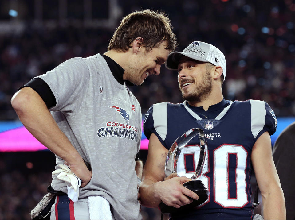 FILE - New England Patriots quarterback Tom Brady, left, speaks to wide receiver Danny Amendola (80) after winning the AFC championship NFL football game against the Jacksonville Jaguars, on Jan. 21, 2018, in Foxborough, Mass. Amendola, who earned two Super Bowl rings with the Patriots and became one of Tom Brady’s favorite playmakers during his five seasons in New England, is retiring. (AP Photo/David J. Phillip, File)