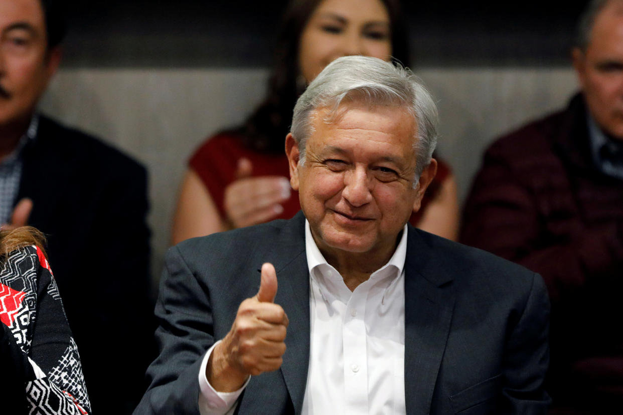 Andres Manuel Lopez Obrador, presidential candidate of the National Regeneration Movement (MORENA) gives a thumbs up to members of Partido del Trabajo (Labor Party), in Mexico City, Mexico February 19, 2018. REUTERS/Carlos Jasso