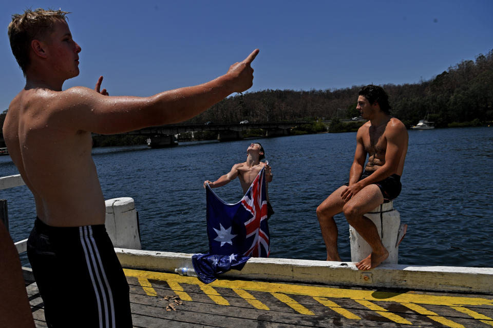 Residents cool off in the fire affected Clyde River near Batemans Bay on Australia Day.