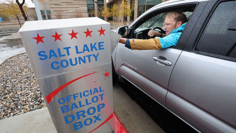 Guy Evans casts his mail in ballot in Cottonwood Heights on Tuesday, Nov. 8, 2022.