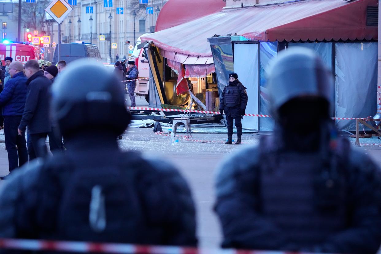 Russian police officers are seen at the site of an explosion at a cafe in St. Petersburg, Russia (Copyright 2023 The Associated Press. All rights reserved)