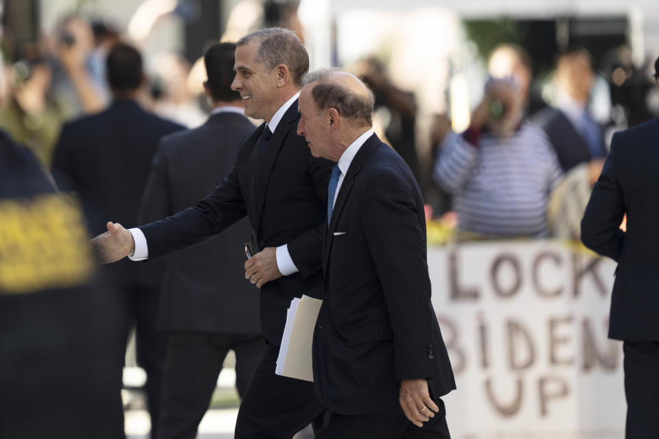 Hunter Biden, with his lawyer, arrives for his court appearance in Wilmington, Del. 