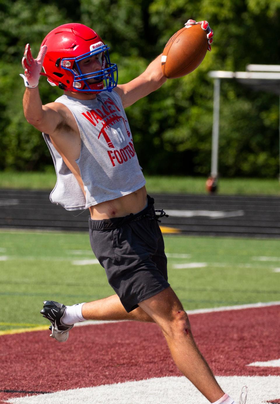 Licking Valley's Ayden Stalnaker runs the ball in for a touchdown during a 7-on-7 scrimmage at Columbus Academy last month.