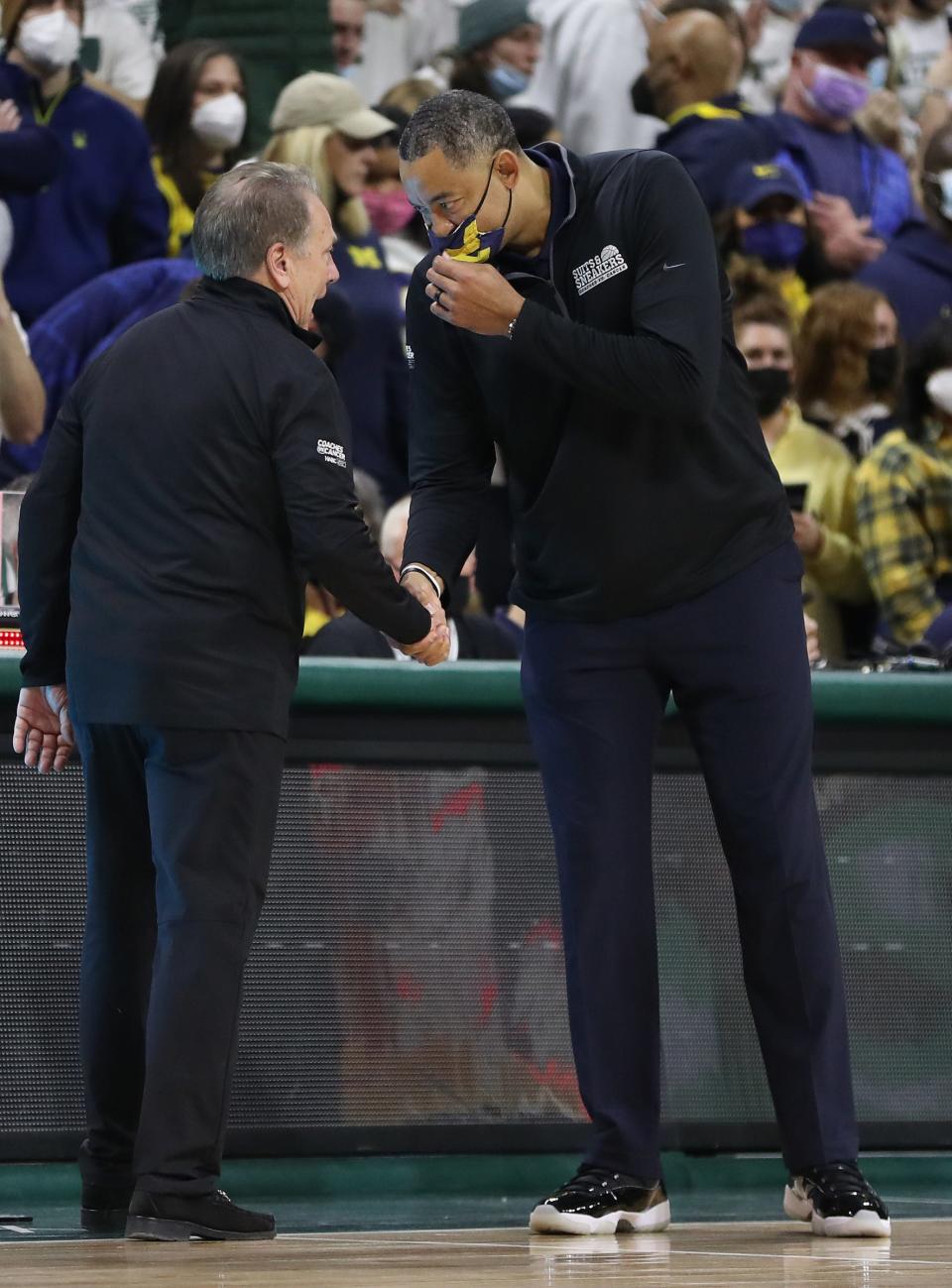 Michigan State Spartans head Tom Izzo and Michigan Wolverines head coach Juwan Howard shake hands after the game Saturday, Jan. 29, 2022 at the Breslin Center.