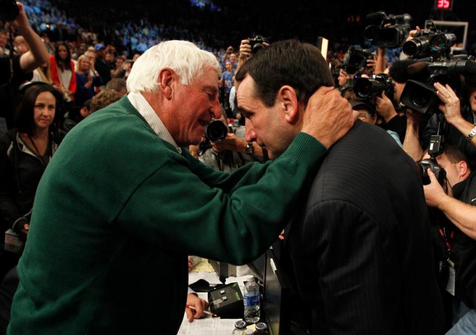 Duke head coach Mike Krzyzewski (right) speaks with mentor and former NCAA D1 record holder Bobby Knight as he wins number 903 to become the winningest coach of all time. Duke played Michigan State University at Madison Square Garden in New York City Tuesday Nov. 15, 2011.Duke played Michigan State University at Madison Square Garden in New York City Tuesday Nov. 15, 2011.