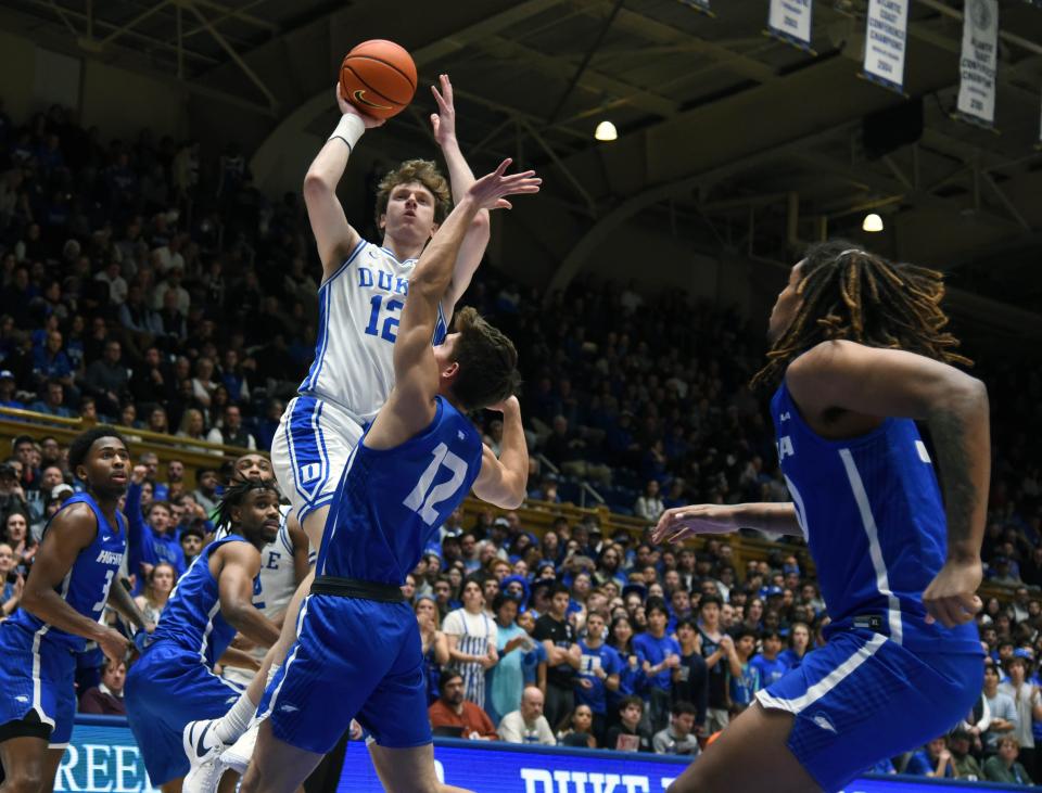 Duke forward TJ Power shoots over Hofstra Bison guard Griffin Barrouk.