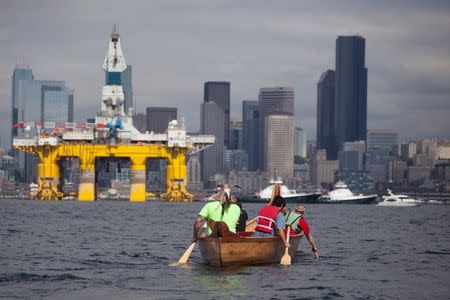 Members of the Duwamish Tribe protest against the Shell Oil Company's drilling rig Polar Pioneer as it arrives in Seattle, Washington, May 14, 2015. REUTERS/Matt Mills McKnight