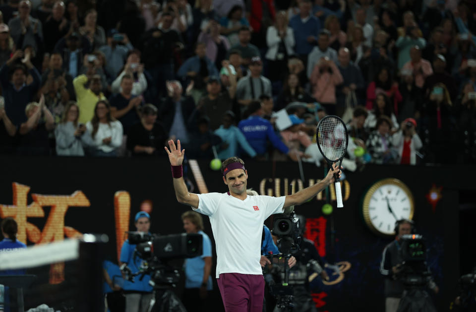 Roger Federer celebrates to the crowd at the 2020 Australian Open.