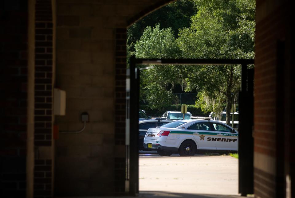 A Leon County Sheriff's Office cruiser is seen through the entrance to Chiles High School during a safety drill on Thursday, July 28, 2022 in Tallahassee, Fla.