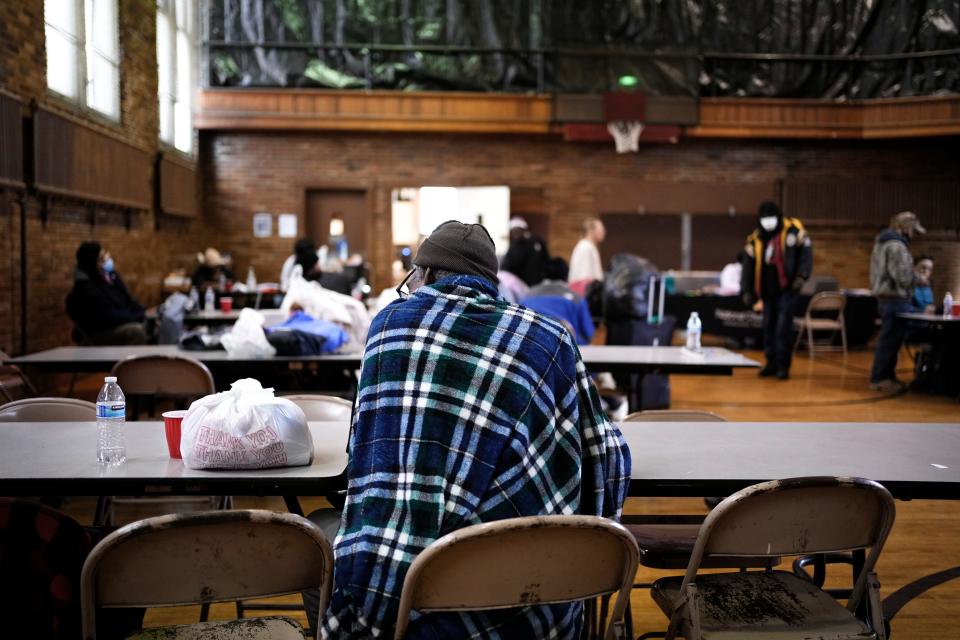 Rodney Sharp, 64, sits with a hot beverage inside the warming shelter for homeless at Broad Street United Methodist Church. The shelter is currently open during the day from Mondays through Fridays but will switch to a 24/7 operation beginning Dec. 15 and remain that way through March.