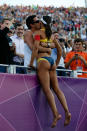 Juliana Silva of Brazil climbs into the crowd as she celebrates winning the Bronze medal in the Women's Beach Volleyball Bronze medal match against China on Day 12 of the London 2012 Olympic Games at the Horse Guard's Parade on August 8, 2012 in London, England. (Photo by Jamie Squire/Getty Images)