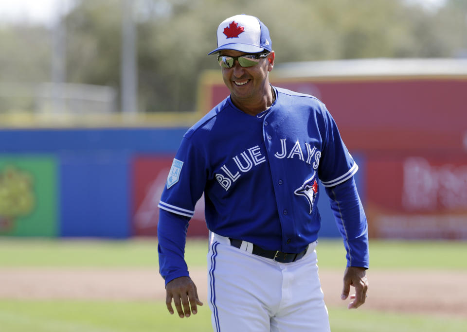 FILE- In this Thursday, Feb. 28, 2019, file photo, Toronto Blue Jays manager Charlie Montoyo watches during a spring training baseball game against the Philadelphia Phillies in Dunedin, Fla. Montoyo thought he would be taking a hard line against video games in his first year as Blue Jays manager. Before he could put his foot down on Fortnite, the players took it upon themselves to govern their gaming. (AP Photo/Lynne Sladky, File)