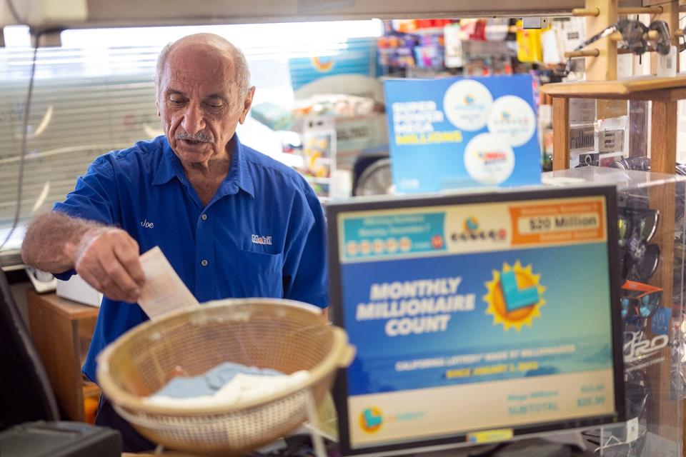 Joe Chahayed, owner of Joe's Service Center in Altadena CA., works at his business Wednesday, Nov 9, 2022. Chahayed received $1 million from the California Lottery for selling the $2.04 billion Powerball ticket at his Altadena gas station minimart.