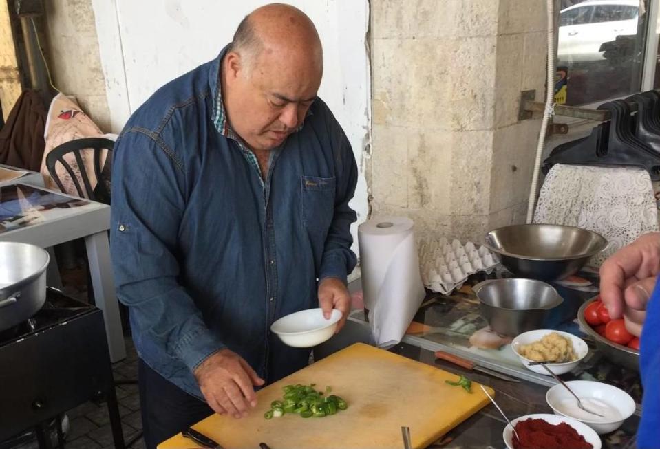 Bino Gabso known as “Dr. Shakshuka,” prepares his famous dish on a trip Shai Fargian and Frank Scibelli took to Israel.