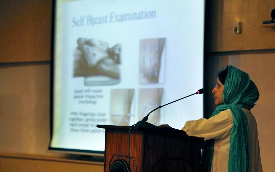 In this Wednesday, Oct. 30, 2013 photo, Pakistani doctor Erum Khan addresses female students during a lecture to promote awareness regarding breast cancer and its precautions at a university in Islamabad, Pakistan. One in nine women in Pakistan will face breast cancer during their life, with the country itself having the highest rate of the disease across Asia, according to the breast cancer awareness group PinkRibbon, oncologists and other aid groups. Yet discussing it remains taboo in a conservative, Islamic culture where the word breast is associated with sexuality instead of health and many view it as immoral for women to go to the hospital for screenings or discuss it even within their family. (AP Photo/Anjum Naveed)