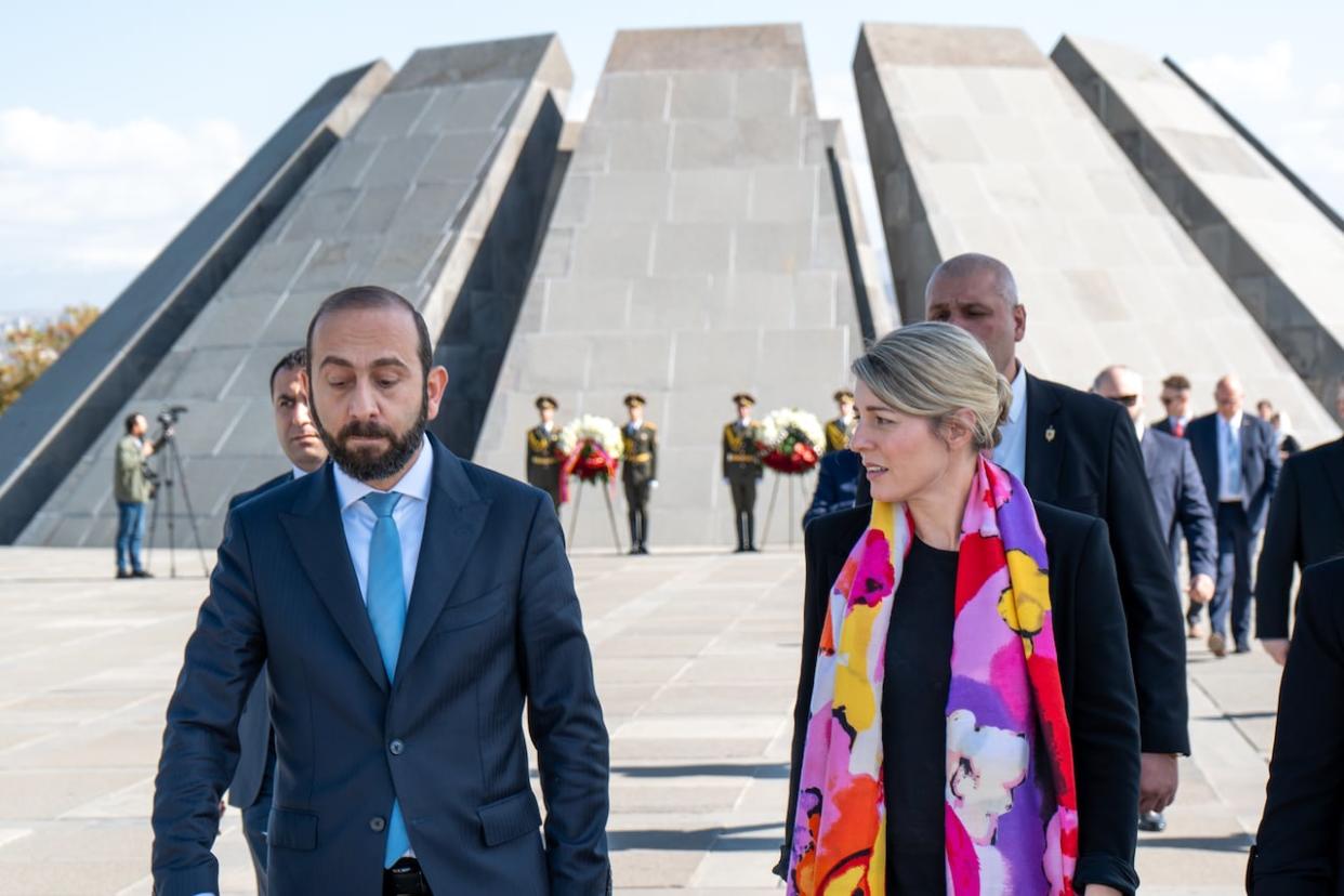 Foreign Affairs Minister Mélanie Joly and her Armenian counterpart, Ararat Mirzoyan, during her official visit to Armenia on October 25, 2023, in front of the Armenian Genocide Memorial Complex. (Fin De Pencier/CBC  - image credit)