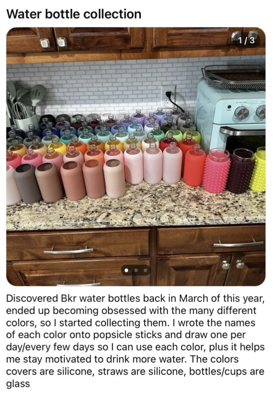 A kitchen counter with an array of water bottles with silicone covers in different colors: "Discovered Bkr water bottles back in March, ended up becoming obsessed with the many different colors, so I started collecting them"