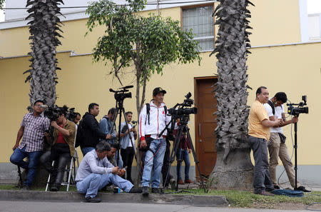 Media wait outside former Peruvian President Alan Garcia's home after Uruguay rejected a request for Garcia's asylum, in Lima, Peru December 3, 2018 REUTERS/Mariana Bazo